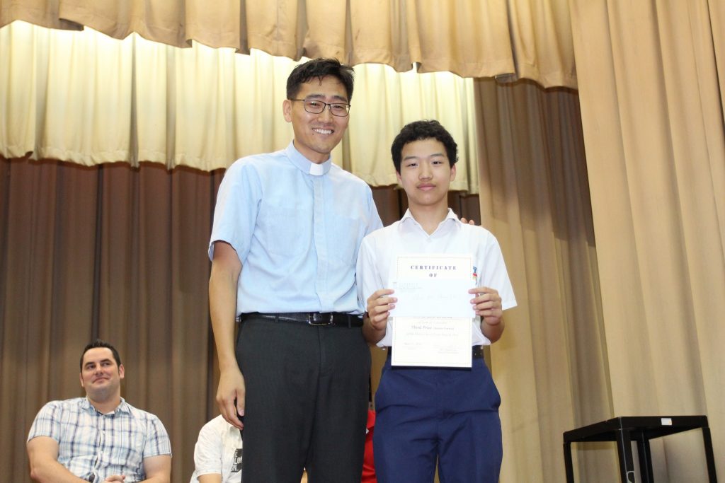 Rev Heewoo Han and the Third Prize winner (Junior Forms) 1C ZHAO Zhi Cheng