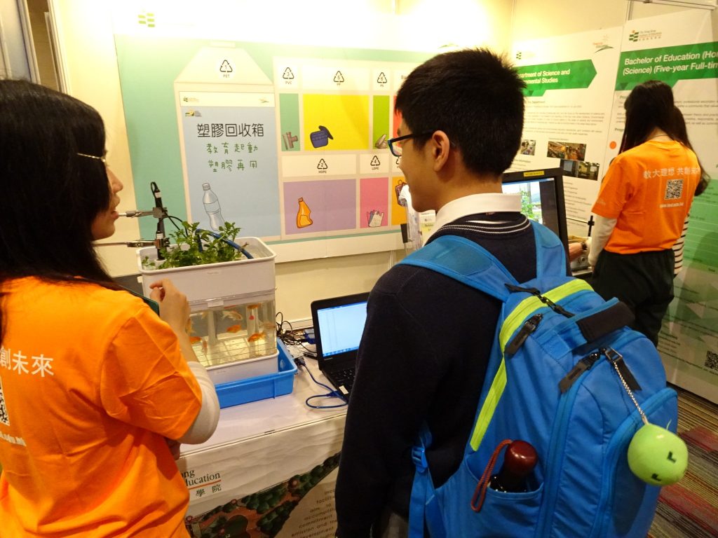 Our student visiting a booth displaying aquaponics