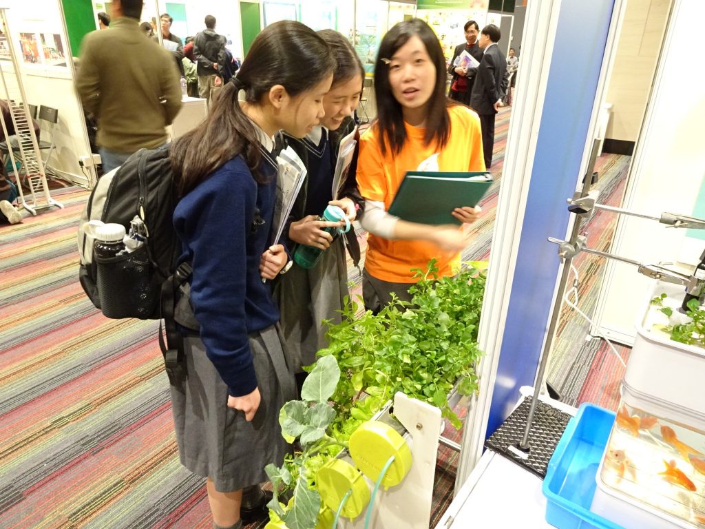 Our students listening to explanation at a booth